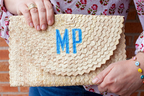 Monogram straw clutch sale